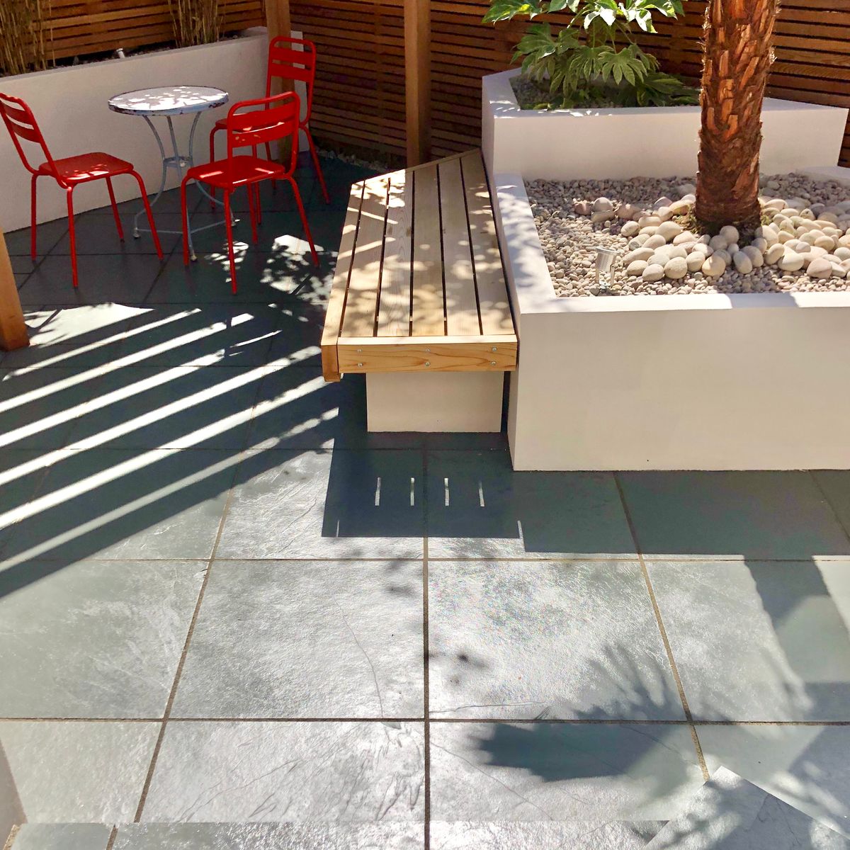 Garden Makeover with Brazilian Slate Paving Installation and Cedar Bench Detailing