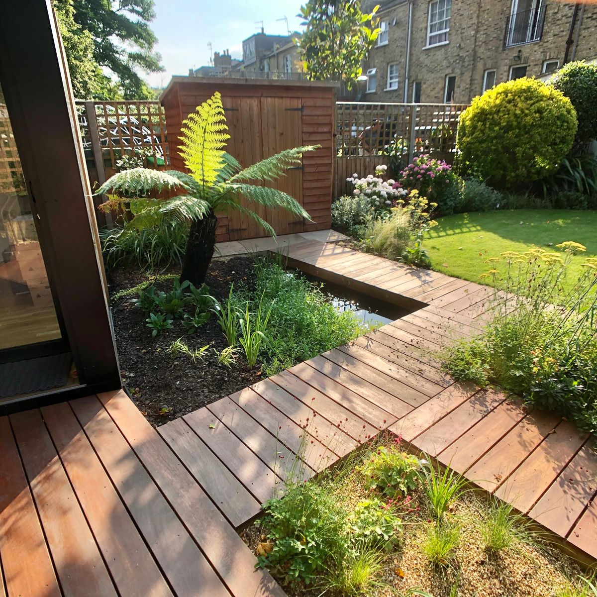 Unique Landscaping Features Including Pond Installation with Planting Design