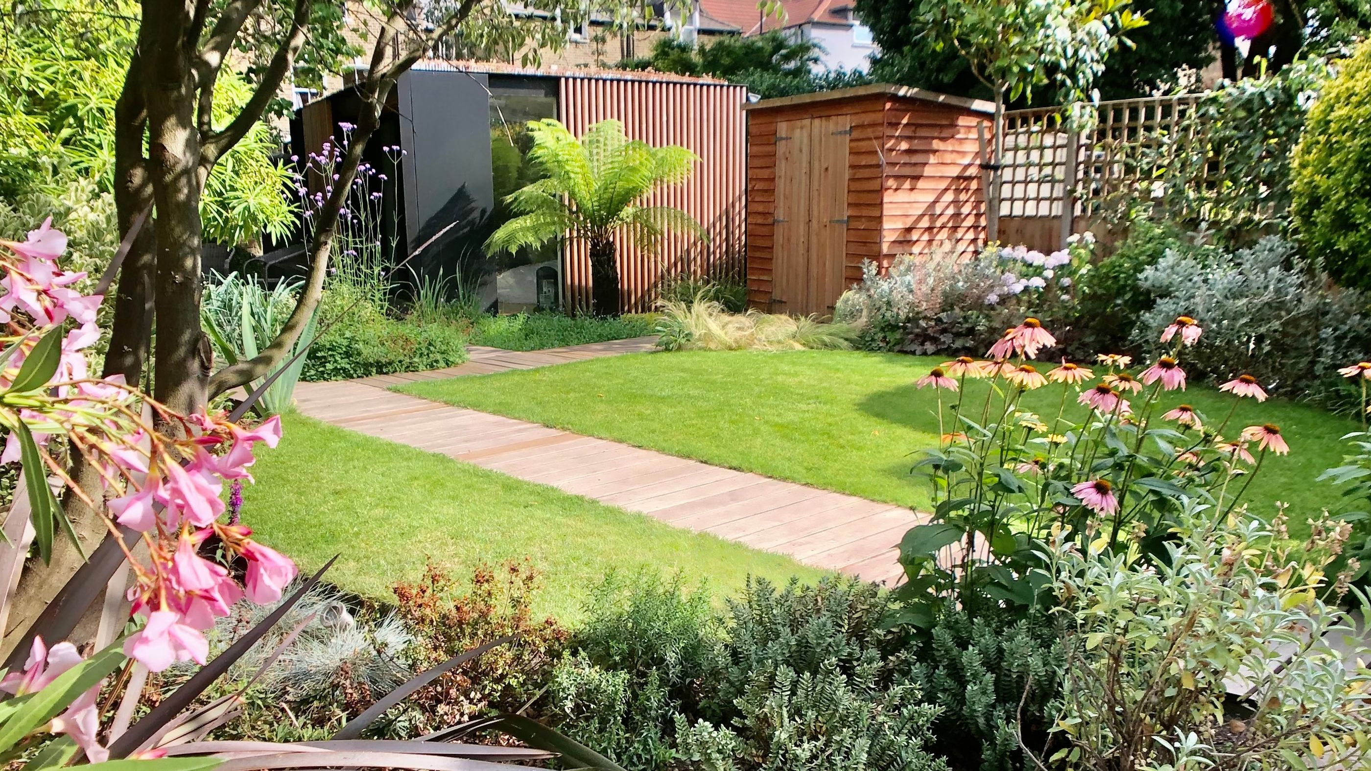 Garden Landscape and Build in Clapton Hackney East London with Integrated Pond Installation and Garden Room