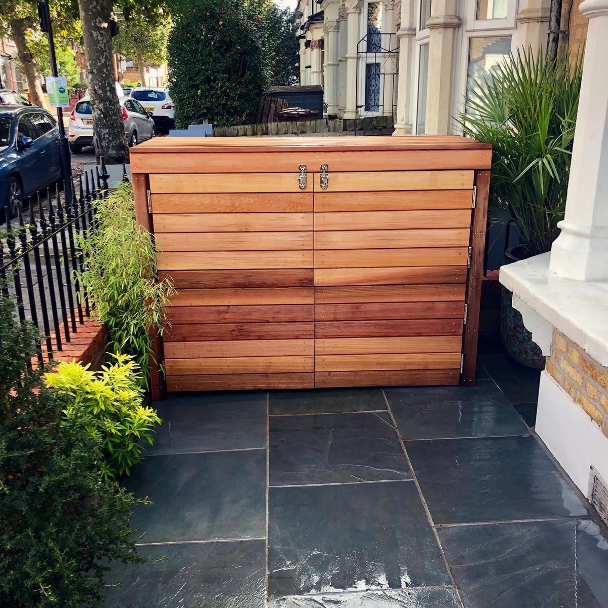 Bespoke Cedar Bin Store with Stainless Steel Fixtures that is Practical but Well Designed for a Small Front Yard