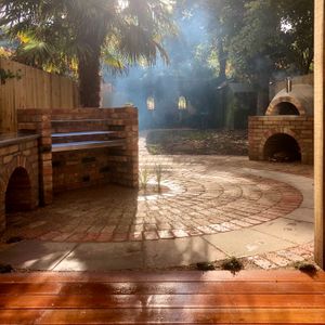 Garden Landscape Design in Crouch End North London with Hard Landscaping including Garden Pizza Oven and Decking Complete with Oak Pergola