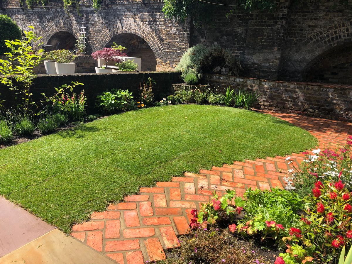 Side View of Curved Herringbone Path and Lawn as part of Columbia Road East London Garden