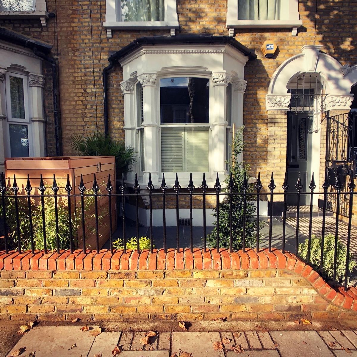 Traditional Railing Design with Cast Iron Spearheads in Small Period Garden