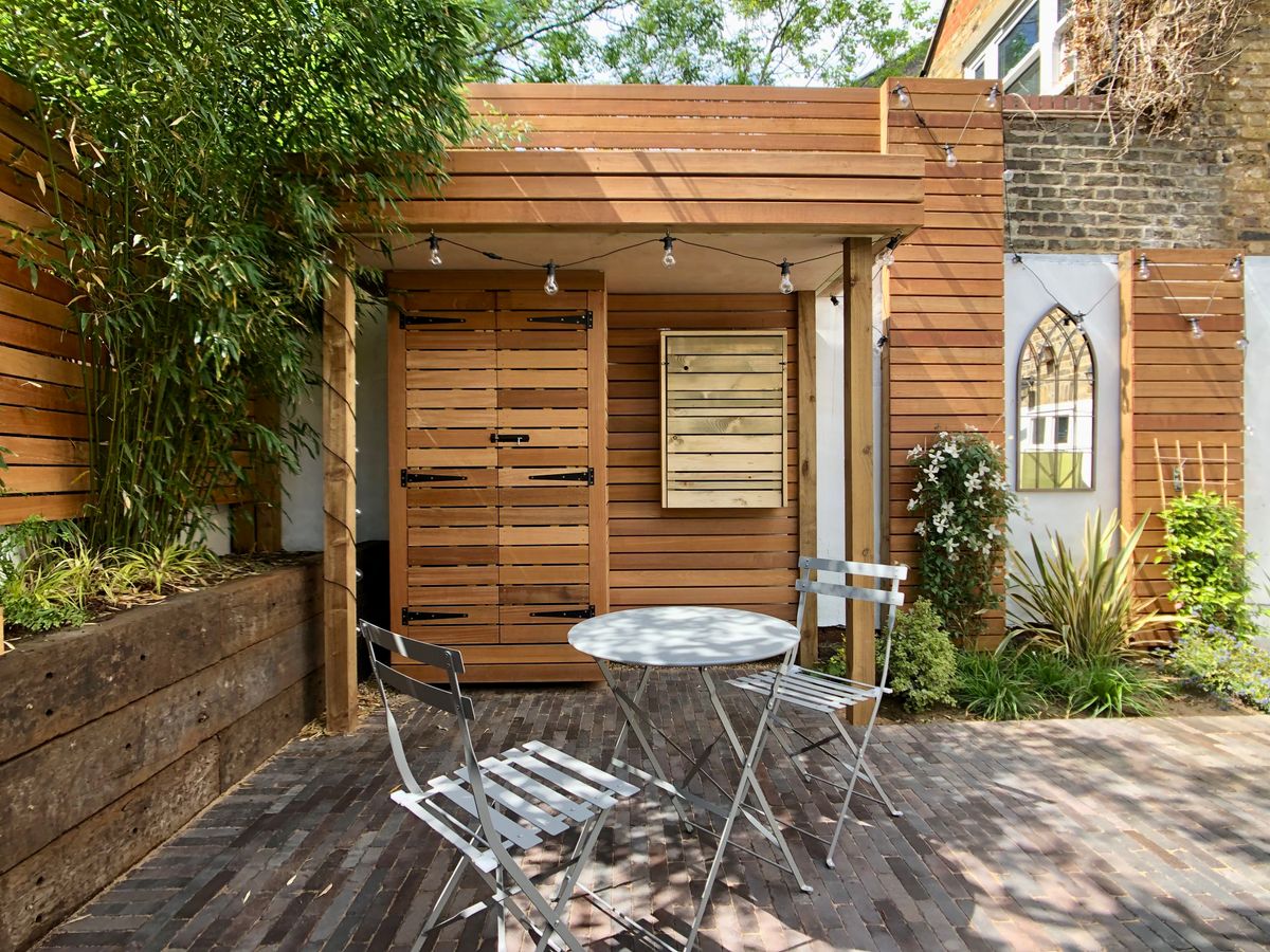 Completed Hackney Central North London Hardscape Design with Yellow Balau Fencing and Dutch Clay Paving