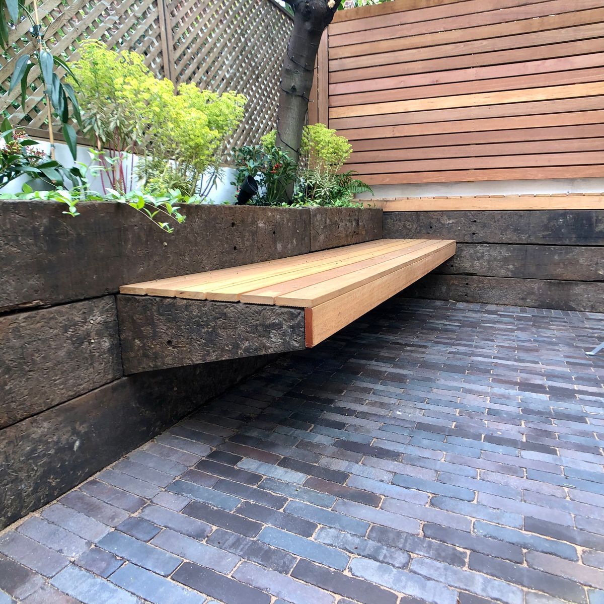 Floating Bench Created from Railway Sleepers and Hardwood as part of Hardscape Design in Hackney Central North London