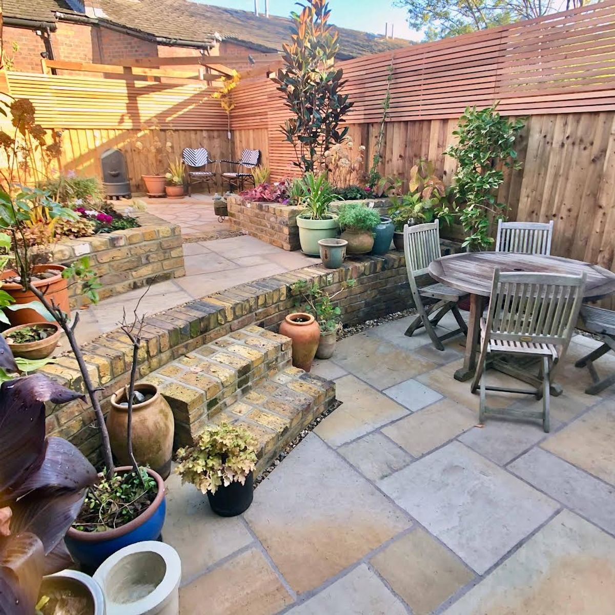 Clever Back Yard Design in Dalston North London Creating a Small Beautiful Garden with Different Levels Split by Brick Retaining Wall