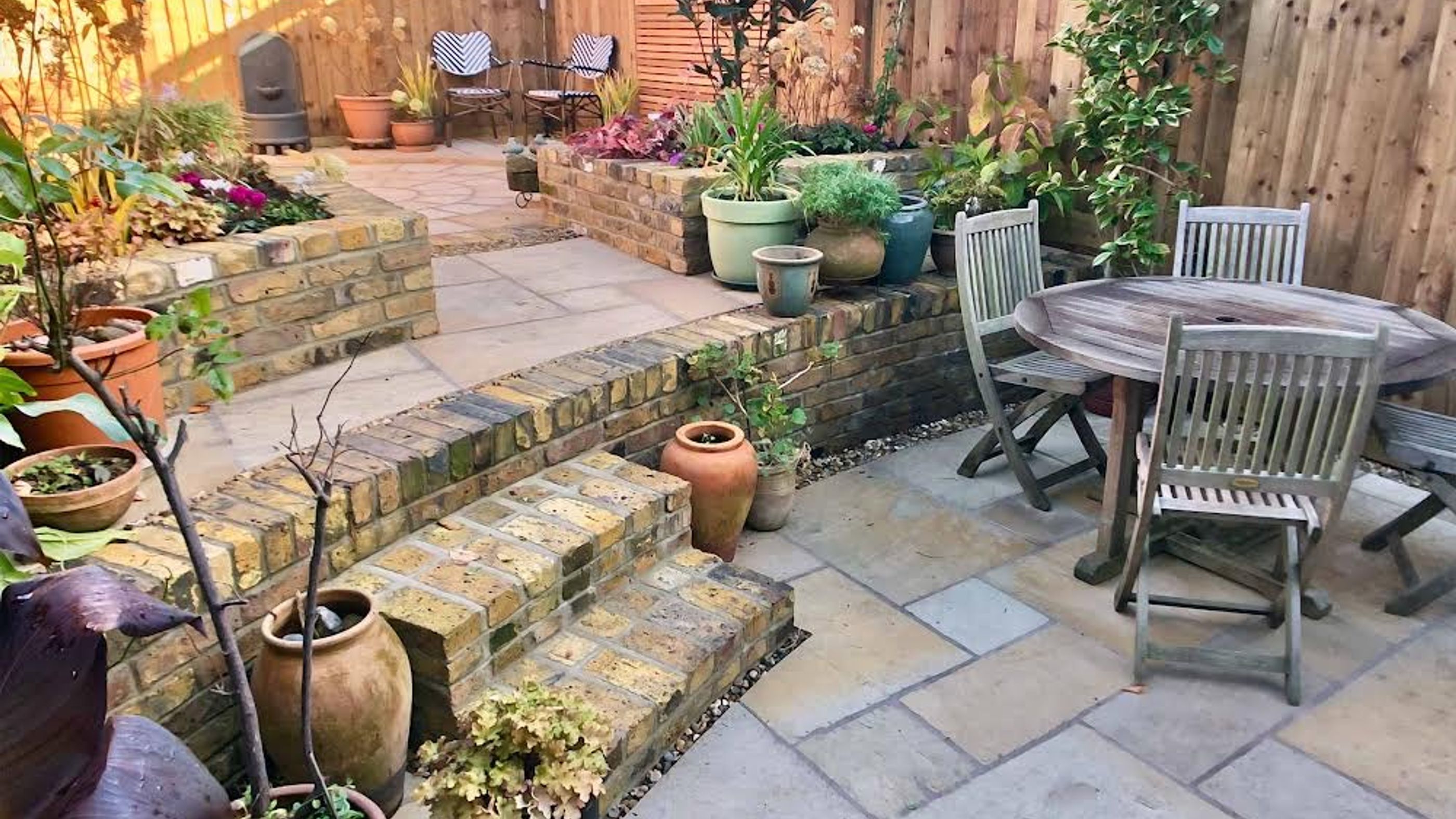 Garden Landscape Design in Dalston Hackney North London with Brick Retaining Wall and Ceder Trellis