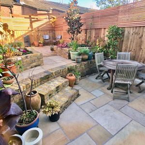 Garden Landscape Design in Dalston Hackney North London with Brick Retaining Wall and Ceder Trellis